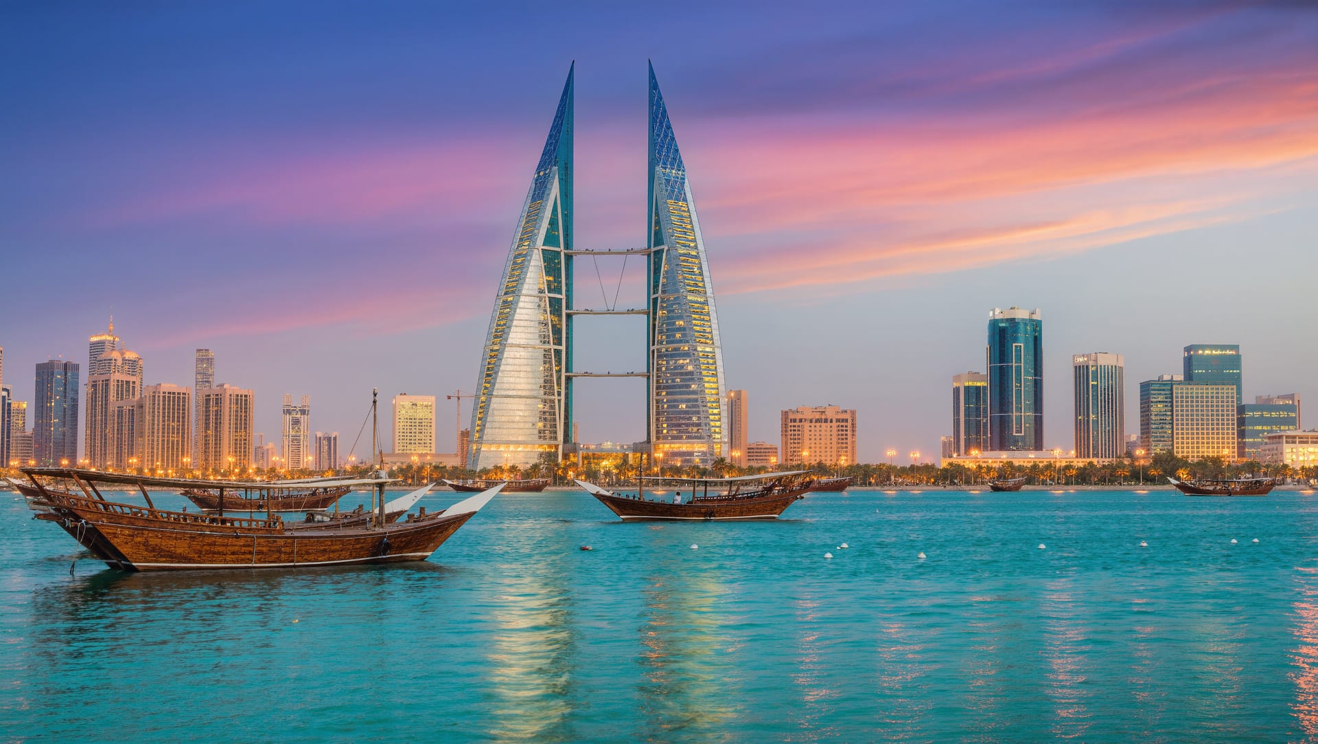 The Manama skyline across the water at dusk, with traditional wooden dhows moored in the foreground